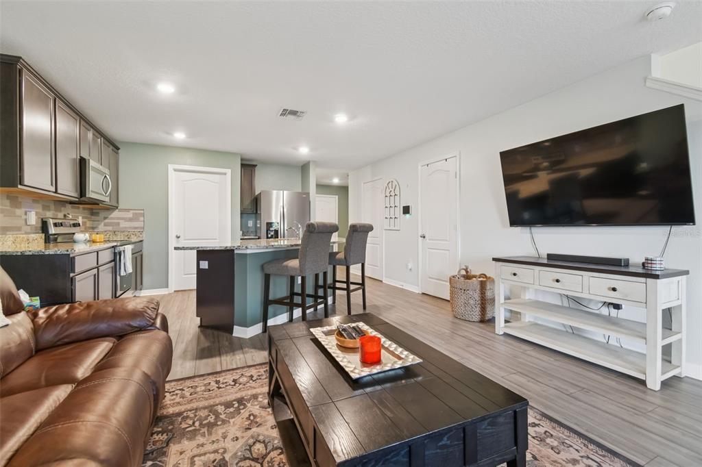 5228 New Friendship Place Tampa, FL 33619 - Photo 11 of 49 a living room with furniture and a flat screen tv