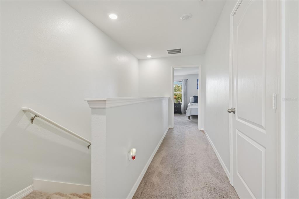 5228 New Friendship Place Tampa, FL 33619 - Photo 15 of 49 a view of a hallway with wooden floor and entryway