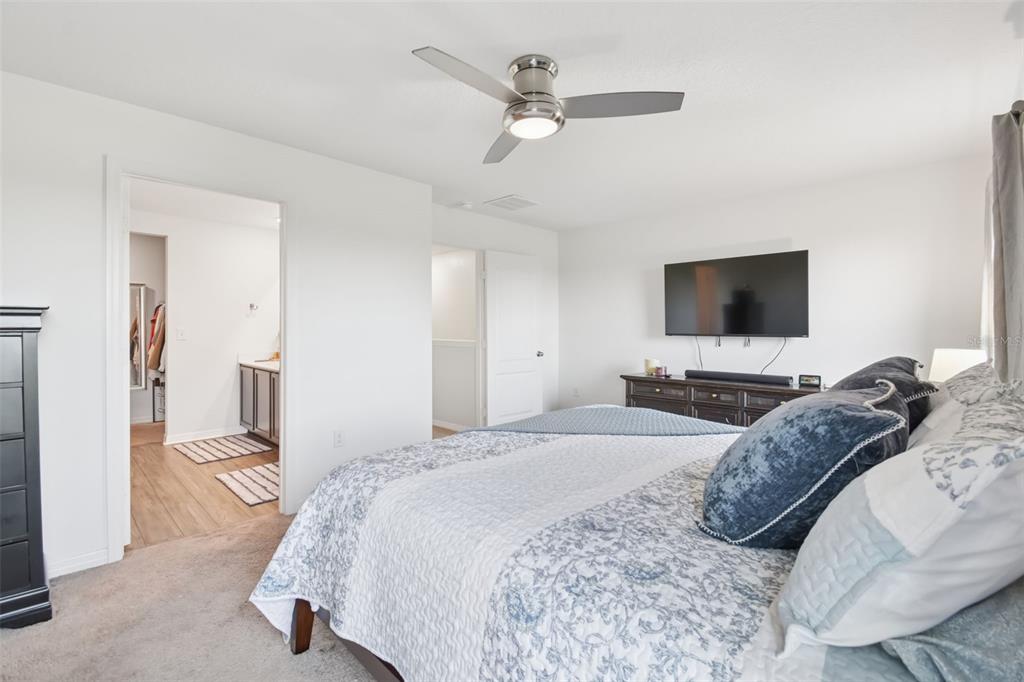 5228 New Friendship Place Tampa, FL 33619 - Photo 17 of 49 a bedroom with a bed window and a flat screen tv