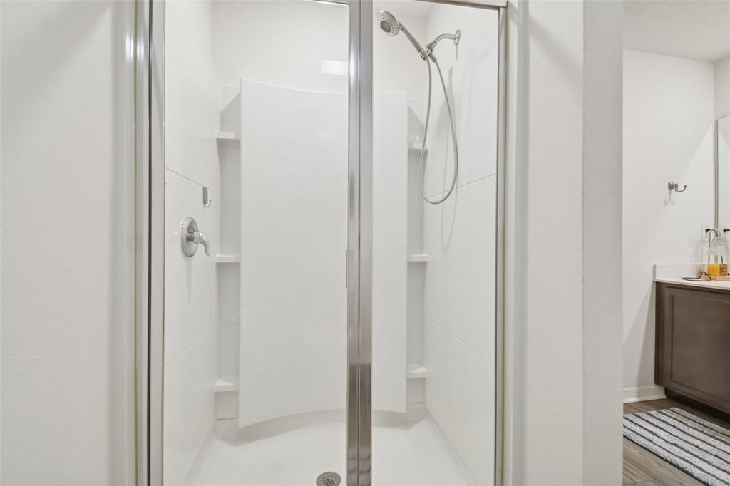 5228 New Friendship Place Tampa, FL 33619 - Photo 19 of 49 a bathroom with a glass shower door