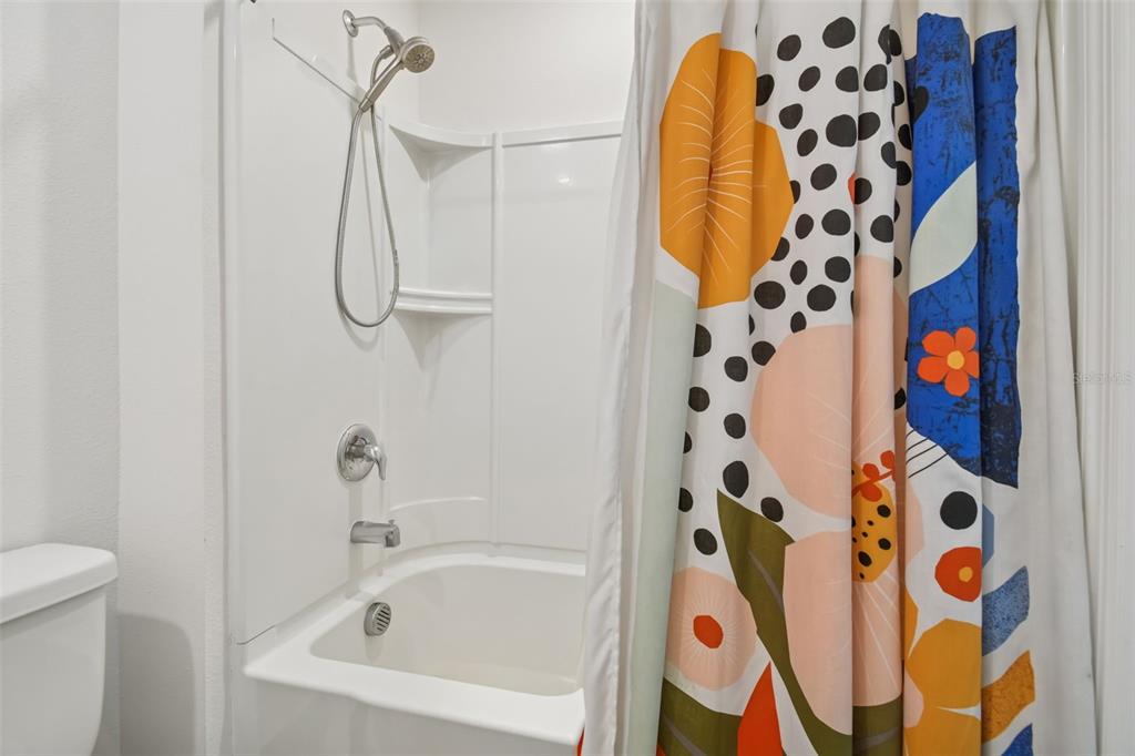 5228 New Friendship Place Tampa, FL 33619 - Photo 25 of 49 a bathroom with a bathtub and shower