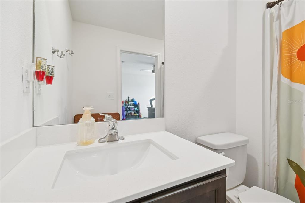 5228 New Friendship Place Tampa, FL 33619 - Photo 26 of 49 a bathroom with a sink and a mirror