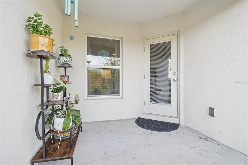 5228 New Friendship Place Tampa, FL 33619 - Photo 29 of 49 a front view of a house with outdoor seating