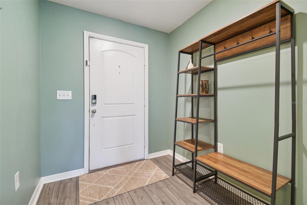 5228 New Friendship Place Tampa, FL 33619 - Photo 30 of 49 a view of bedroom with furniture and wooden floor