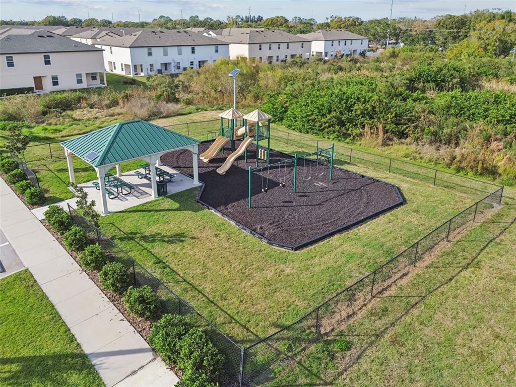 5228 New Friendship Place Tampa, FL 33619 - Photo 36 of 49 a view of a house with a yard