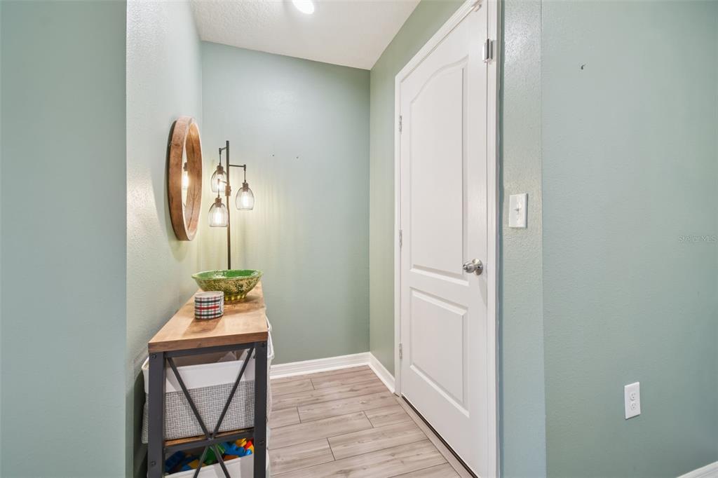 5228 New Friendship Place Tampa, FL 33619 - Photo 4 of 49 a view of an entryway with wooden floor