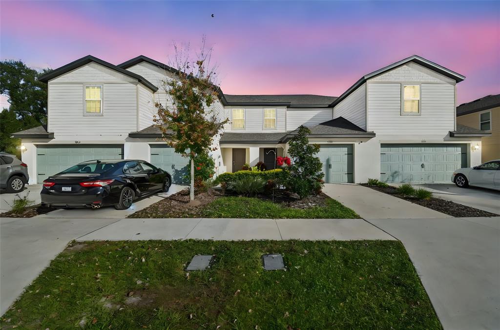 5228 New Friendship Place Tampa, FL 33619 - Photo 41 of 49 a front view of a house with a yard and garage