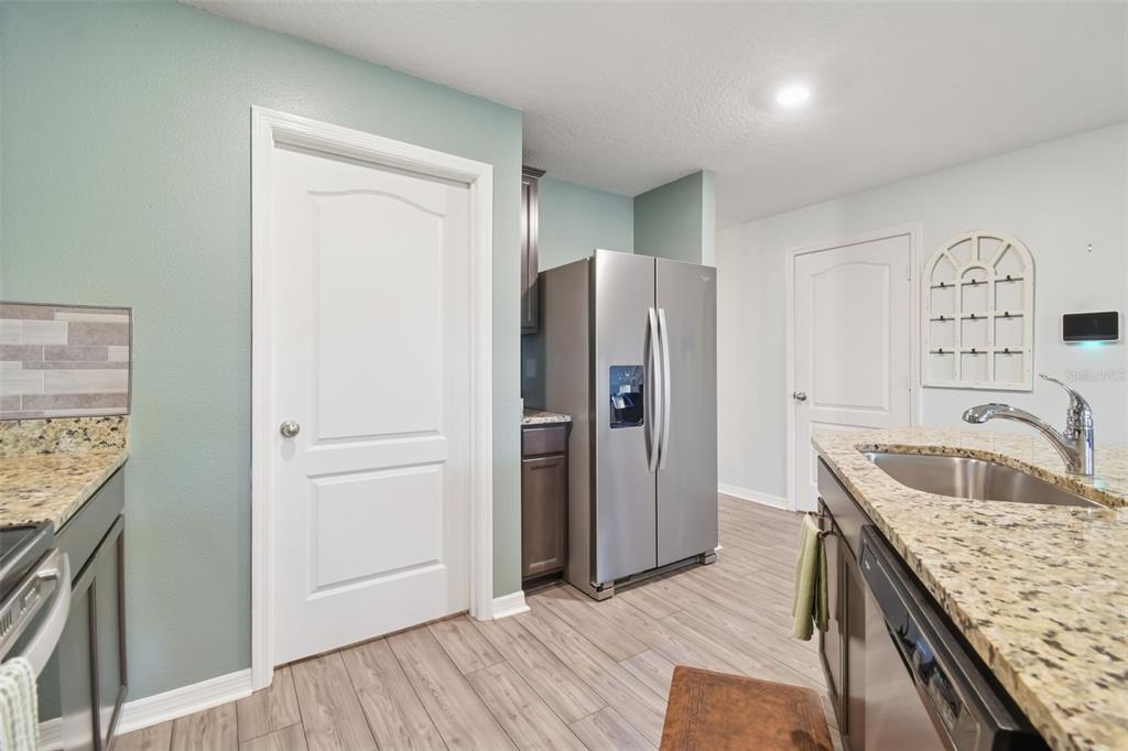 5228 New Friendship Place Tampa, FL 33619 - Photo 6 of 49 a kitchen with stainless steel appliances granite countertop a refrigerator and a sink