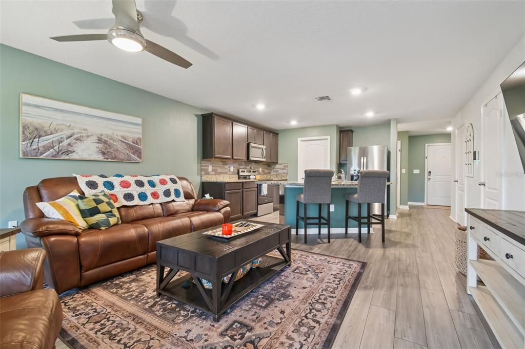 5228 New Friendship Place Tampa, FL 33619 - Photo 9 of 49 a living room with furniture and a wooden floor