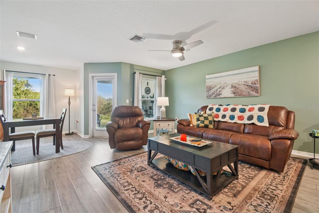 5228 New Friendship Place Tampa, FL 33619 - Photo 10 of 49 a living room with furniture and a wooden floor