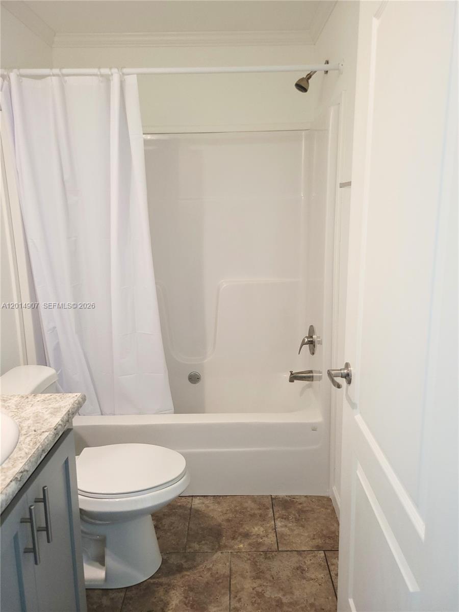 799 Hazel Street, Unit 799 Key Largo, FL 33037 - Photo 11 of 13 a bathroom with a granite countertop bathtub toilet and sink