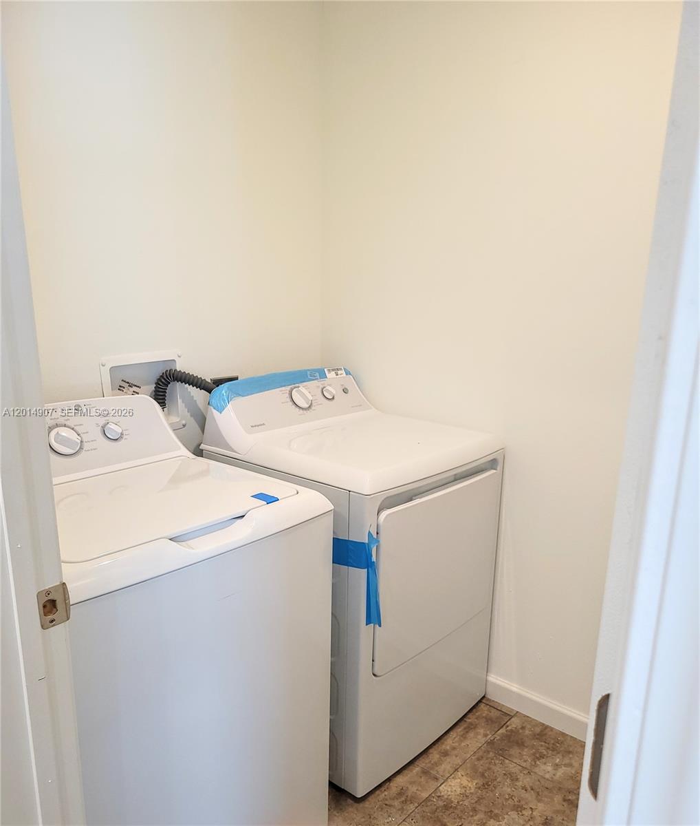 799 Hazel Street, Unit 799 Key Largo, FL 33037 - Photo 12 of 13 a utility room with dryer and washer