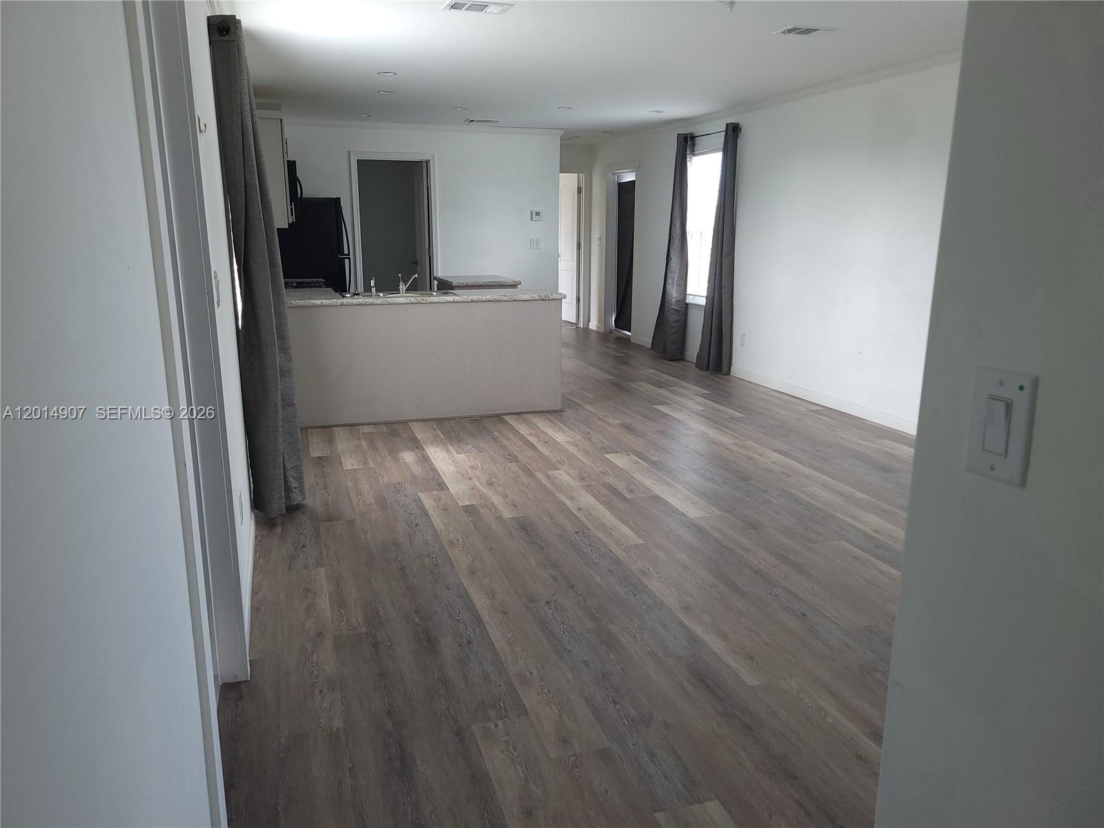 799 Hazel Street, Unit 799 Key Largo, FL 33037 - Photo 5 of 13 wooden floor in an empty room