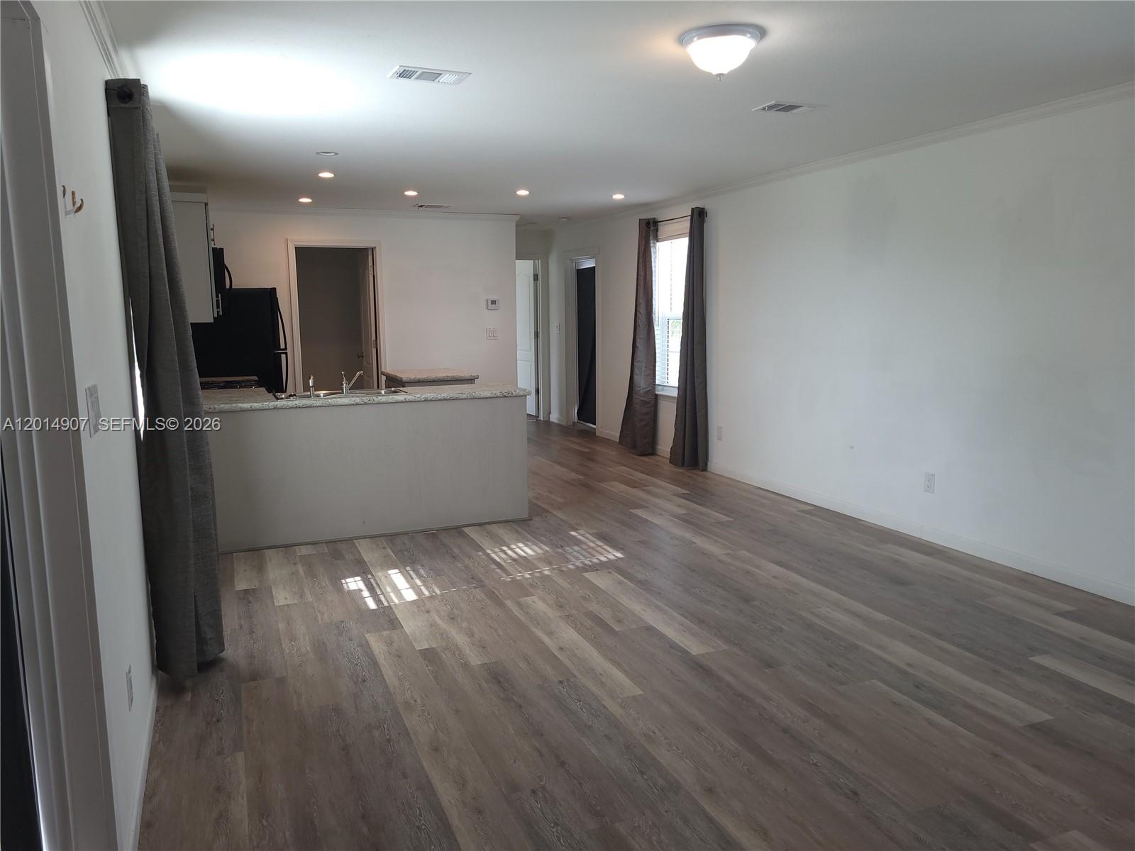 799 Hazel Street, Unit 799 Key Largo, FL 33037 - Photo 6 of 13 a view of kitchen and hall with wooden floor