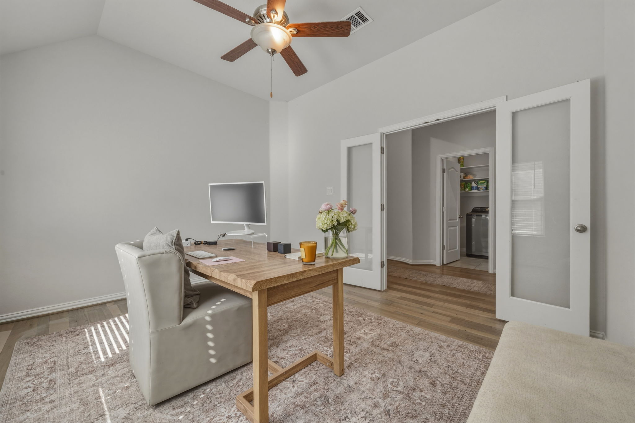 918 Leadtree Loop Buda, TX 78610 - Photo 5 of 27 Home office with ceiling fan, light wood finished floors, and vaulted ceiling