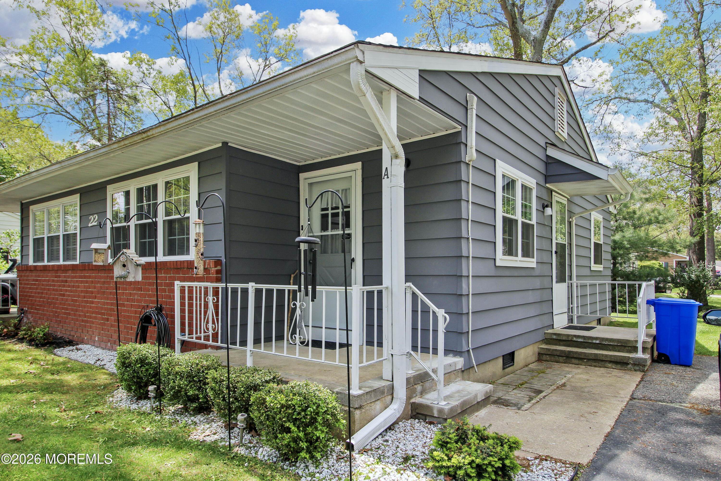 22 A Roosevelt City Road Whiting, NJ 08759 - Photo 16 of 18 a front view of a house with a garden