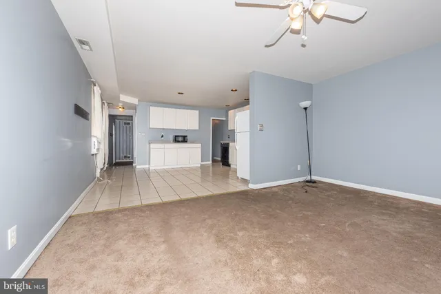 a view of empty room with a fireplace