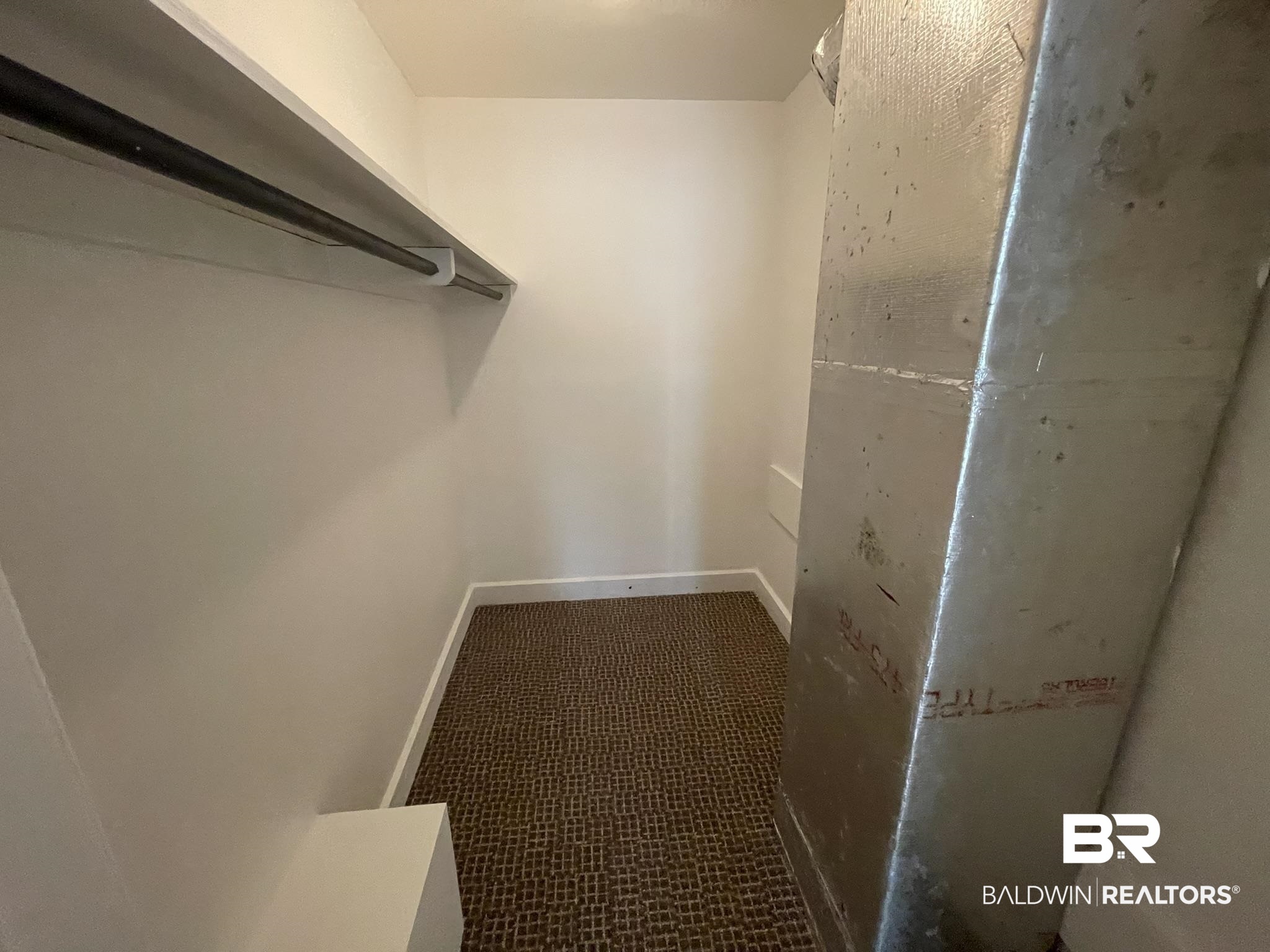 6621 Purvis Road Daphne, AL 36527 - Photo 40 of 59 Walk in closet with dark carpet