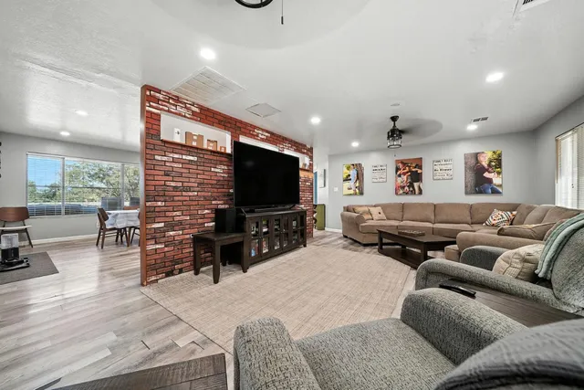 a kitchen with stainless steel appliances a refrigerator and cabinets