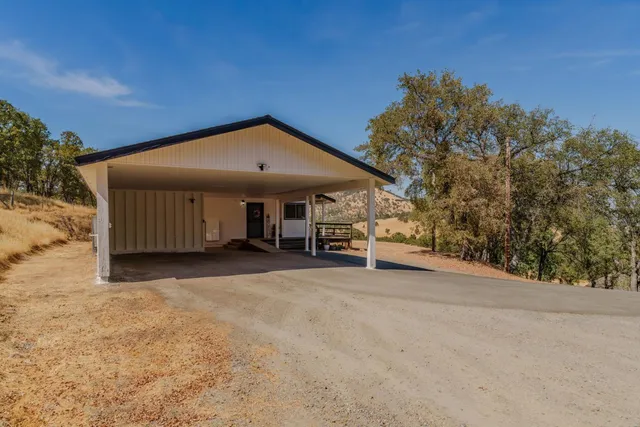 a view of a house with wooden floor and wooden roof