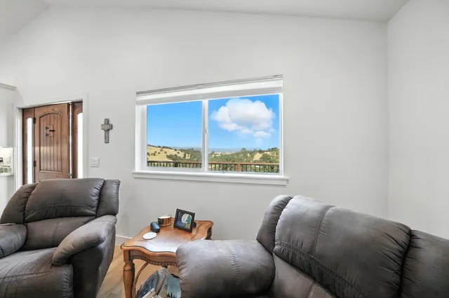 a work room with furniture and a flat screen tv