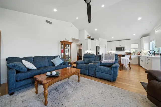 a bathroom with a toilet a sink a vanity and mirror