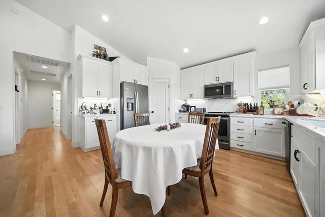 a view of a dry yard with mountains in the background