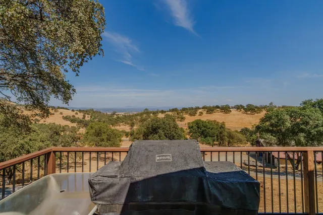 a view of a house with a yard covered in snow