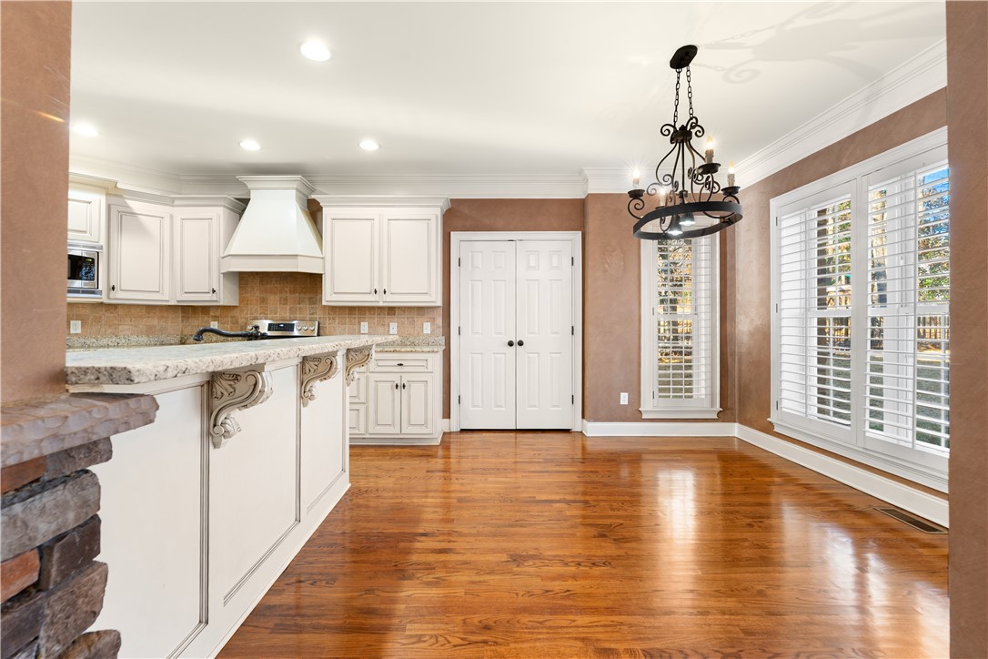 109 Limelight Drive Anderson, SC 29621 - Photo 6 of 34 This spacious kitchen and dining area features rich hardwood floors and an inviting atmosphere.