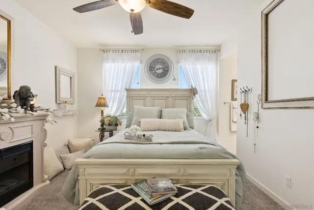 a bedroom with a bed and a fireplace