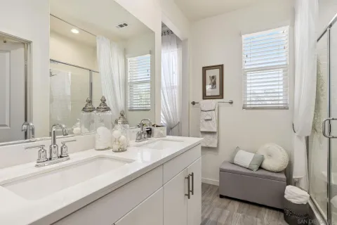 a bathroom with a granite countertop sink mirror and a