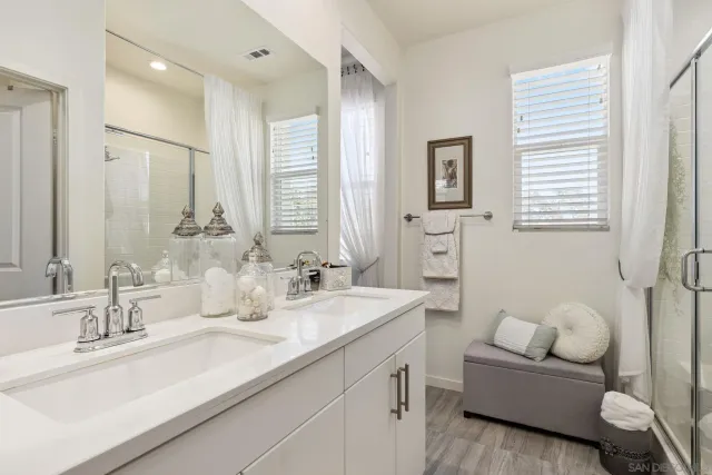 a bathroom with a granite countertop sink mirror and a