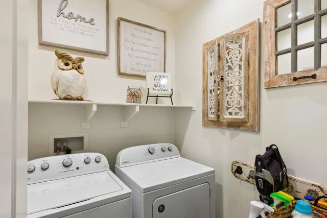 a front view of a house with a porch and a yard