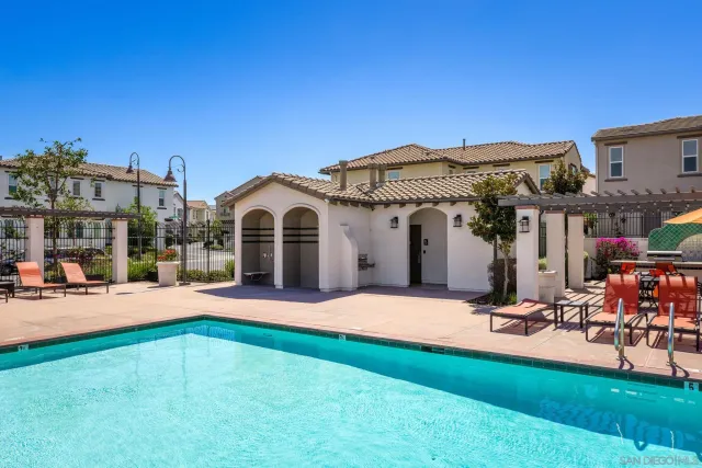 an aerial view of residential houses and outdoor space