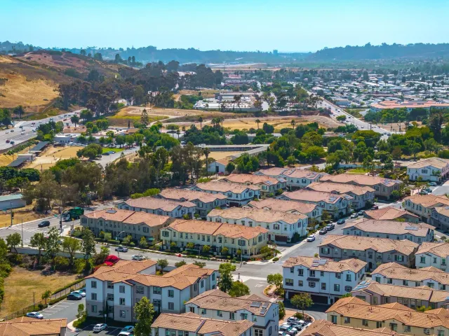 an aerial view of residential houses and outdoor space