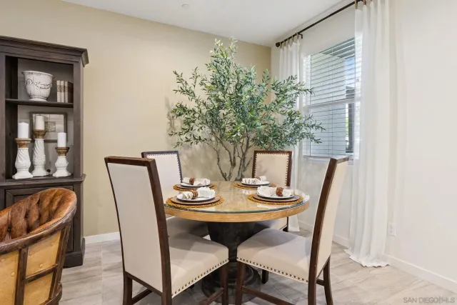 a view of a dining room with furniture and window