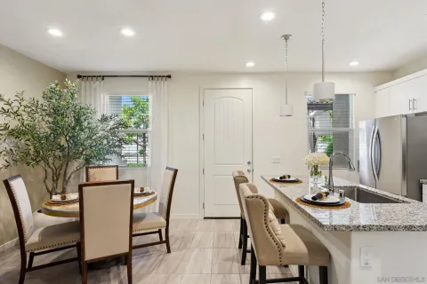a dining room with furniture and window