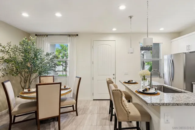 a dining room with furniture and window