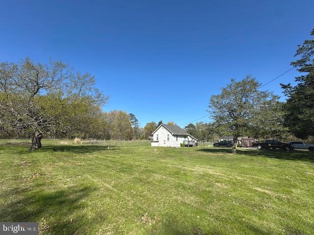 4854 Avery Road Shady Side, MD 20764 - Photo 3 of 30 a view of a lake with a building in the background