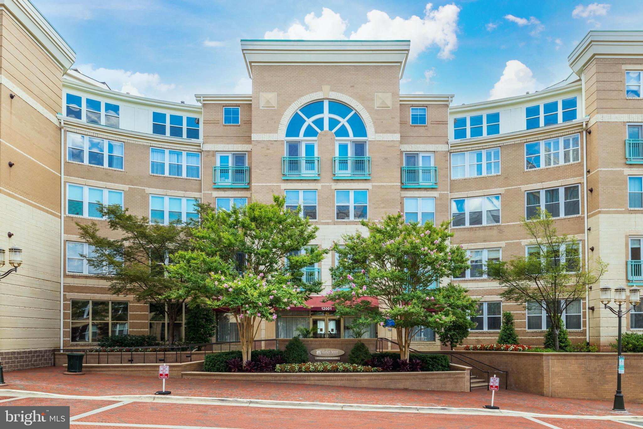 12001 Market Street, Unit 325 Reston, VA 20190 - Photo 1 of 1 a view of a building and a tree