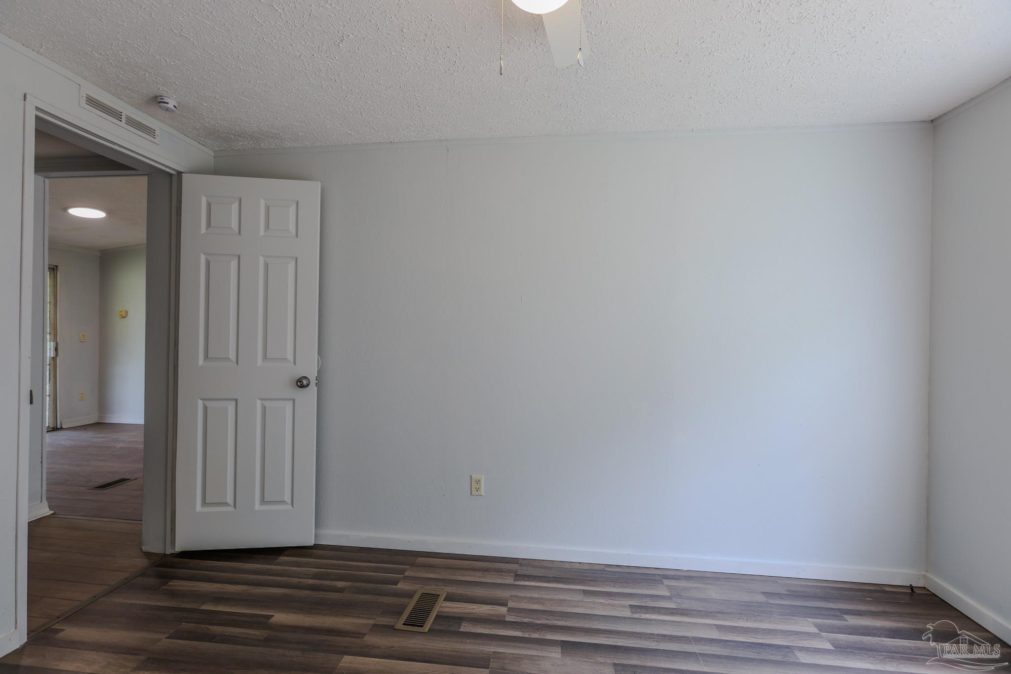 6850 Bratt Road Century, FL 32535 - Photo 13 of 57 a view of wooden floor