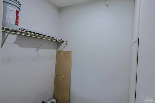 a view of a room with racks on the wall