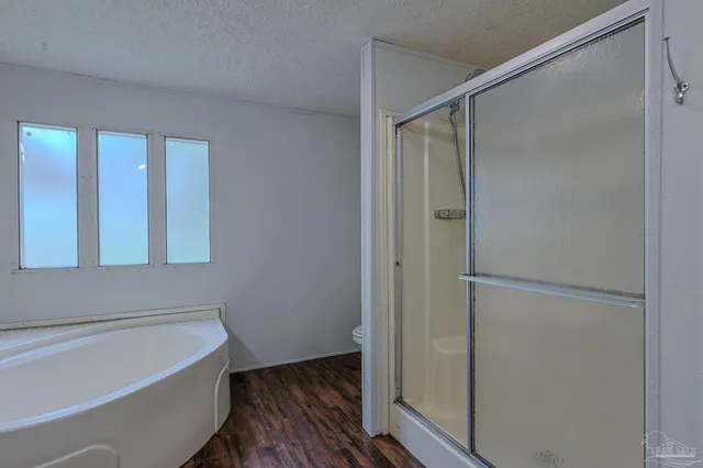 a view of balcony with floor to ceiling window and wooden floor