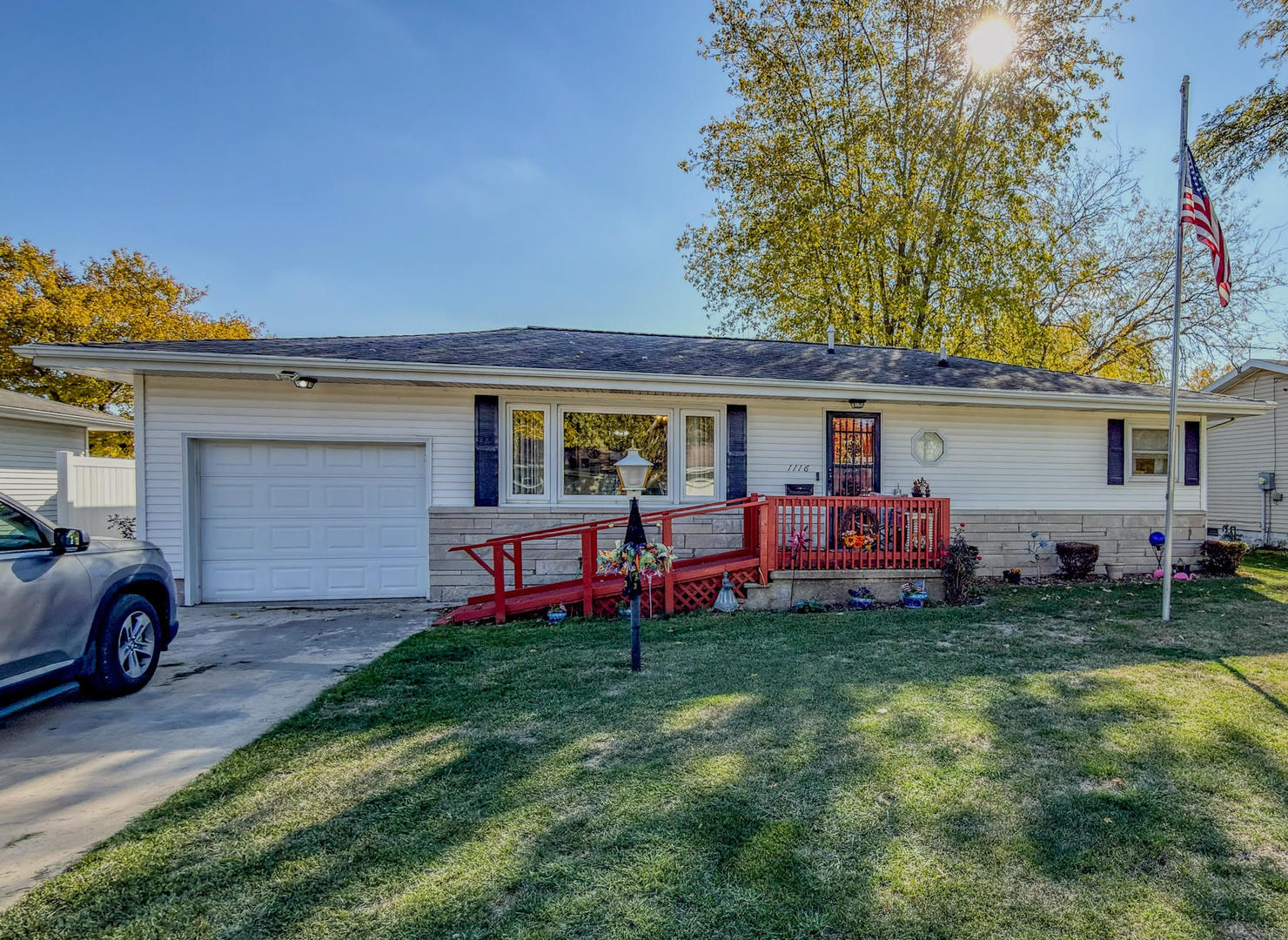 1116 Eastview Drive Paxton, IL 60957 - Photo 1 of 15 a front view of house with yard and seating area