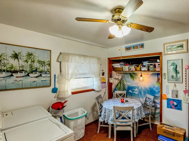 a dining room with furniture and window