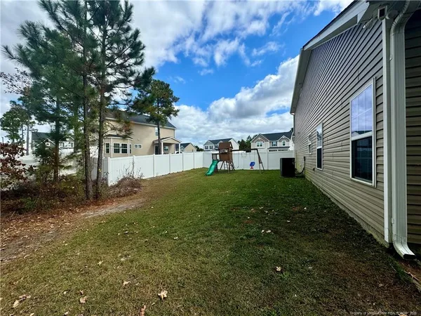 a view of backyard with tree