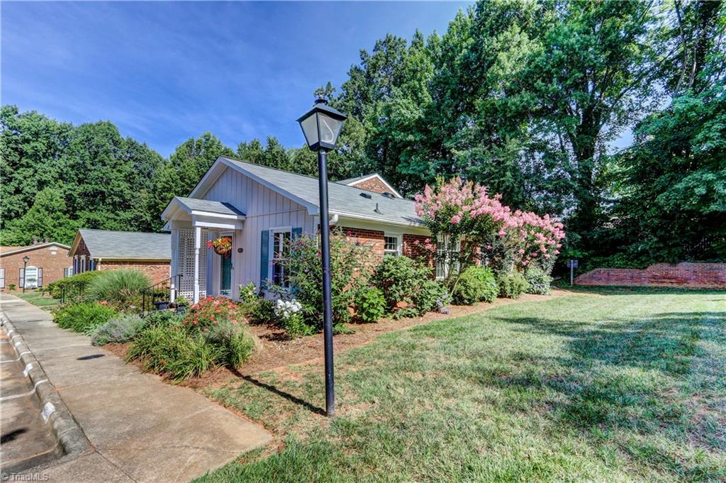 4932 Tower Road, Unit A Greensboro, NC 27410 - Photo 2 of 24 Side Yard
