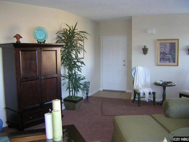 3990 Covington Way, Unit A Reno, NV 89503 - Photo 6 of 9 a living room with furniture potted plant and a lamp