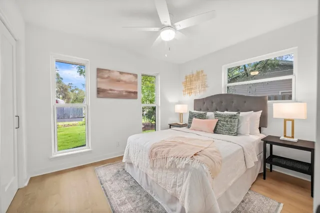 a bedroom with a bed and a window