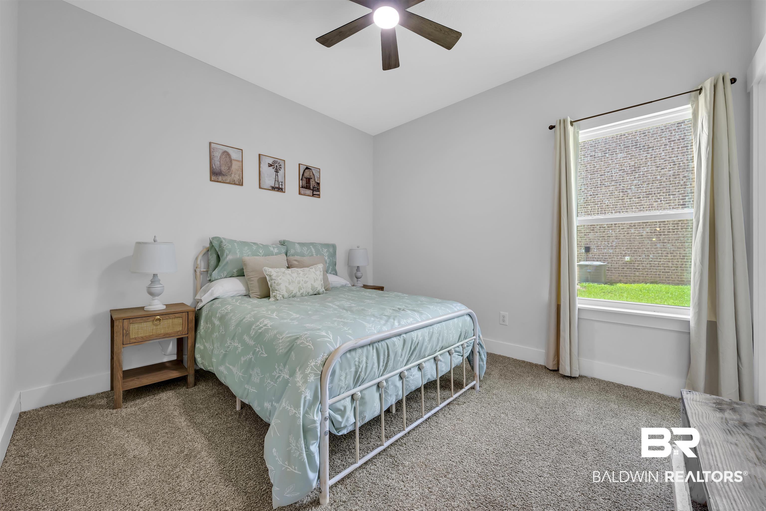 16504 Prado Loop Loxley, AL 36551 - Photo 29 of 45 Carpeted bedroom featuring a ceiling fan and baseboards